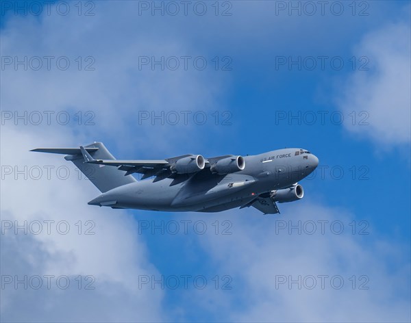 McDonnell Douglas/Boeing C-17 Globemaster III American Air Force cargo plane flying against sky