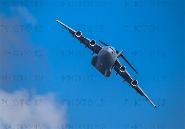 McDonnell Douglas/Boeing C-17 Globemaster III American Air Force cargo plane flying against sky