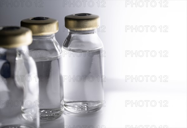 Studio shot of laboratory vials with liquid