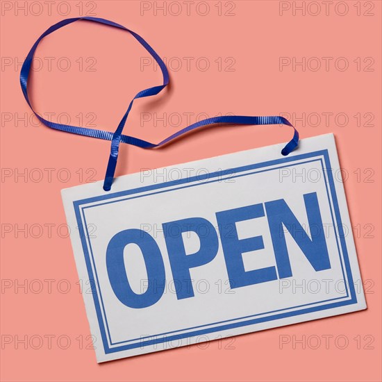 Studio shot of Open sign on pink background