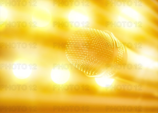 Close-up of microphone and stage lights