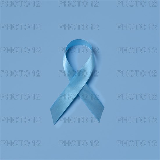 Studio shot of blue ribbon symbolizing prostate cancer