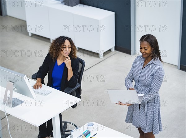 Two women working in office