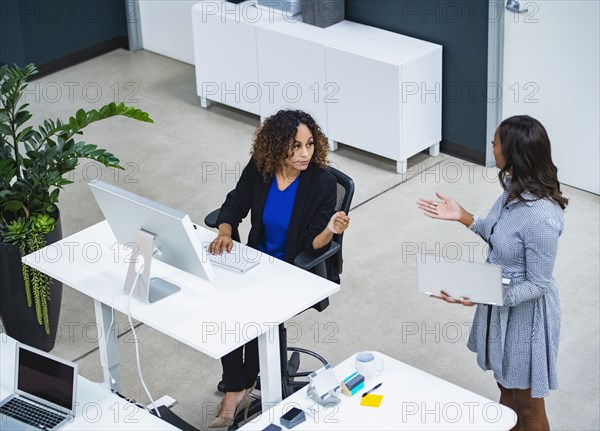 Two women working in office