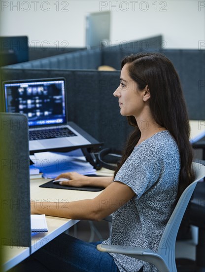 Woman working on computer in office