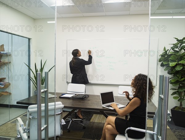 Two businesswomen working in office