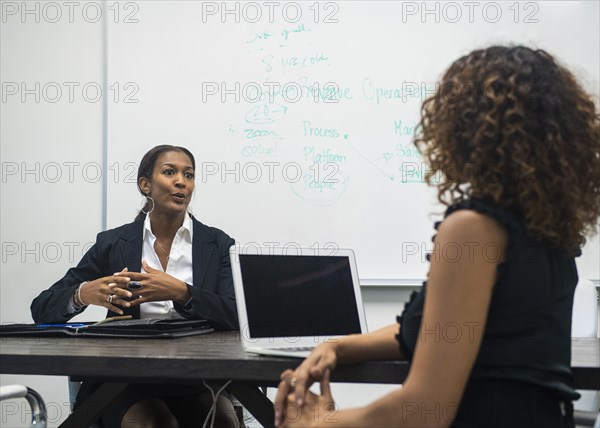 Two businesswomen working in office