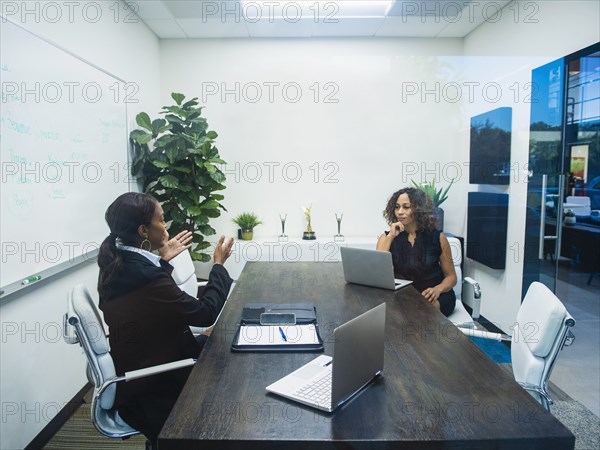 Two businesswomen working in office