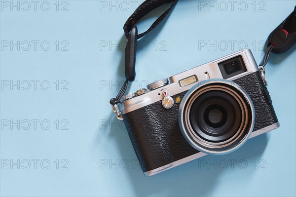 Retro camera on blue background