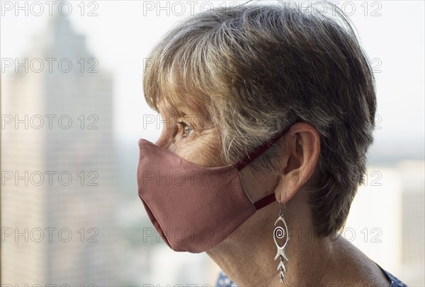 Senior woman wearing protective face mask