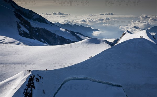 Climbers on mountain ridge at Monte Rosa Massif