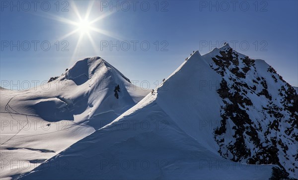 Climbers on mountain ridge at Monte Rosa Massif