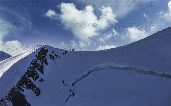 Climbers on mountain ridge at Monte Rosa Massif