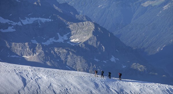 Climbers on mountain ridge at Monte Rosa Massif