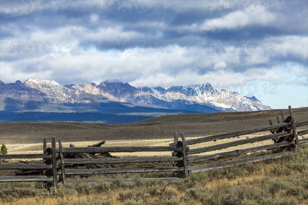 Ranch landscape with mountains and clouds