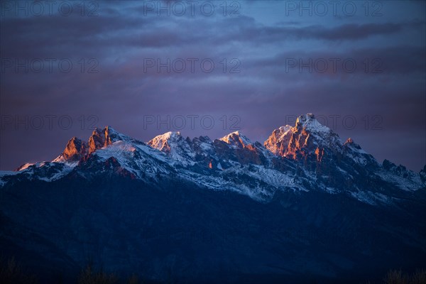 Sunset light on peaks of Teton Range in Grand Teton National Park