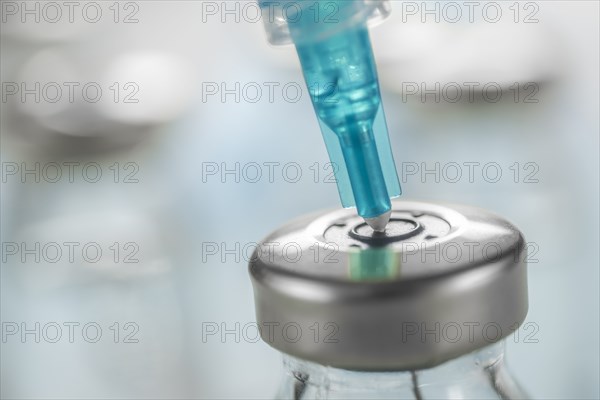 Close-up of Covid-19 vaccine and syringe