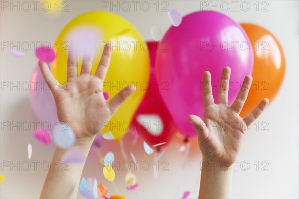 Hands with colorful balloons