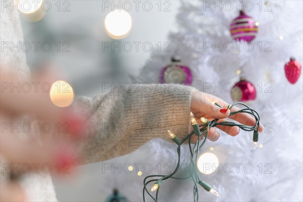 Woman preparing to decorate Christmas tree