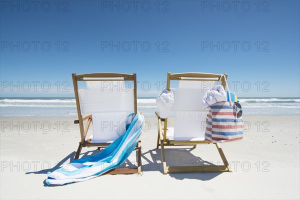 Canvas chairs on beach