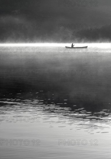 Woman canoeing on Lake Placid Lake