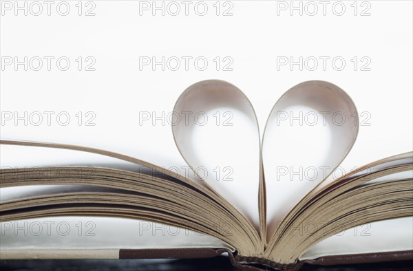 Book with pages folded in heart shape