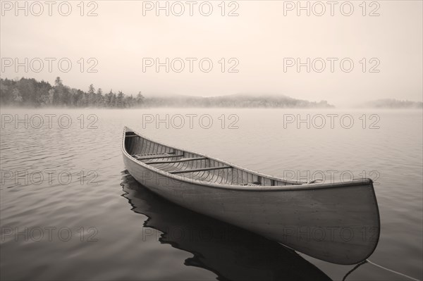 Empty canoe on Upper Saranac Lake