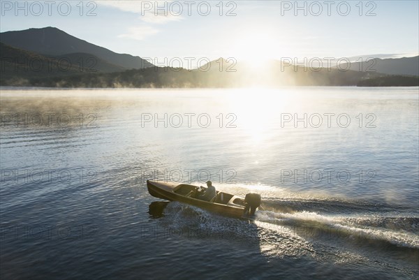 Man in motorboat on Lake Placid