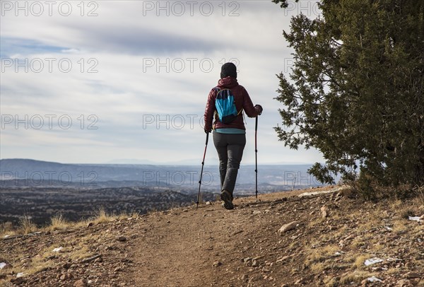 Senior woman hiking in Galisteo Basin Preserve