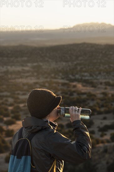 Female hiker taking break in Galisteo Basin Preserve