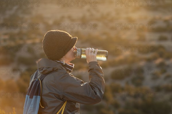 Female hiker taking break in Galisteo Basin Preserve