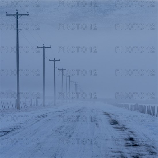 Empty frozen rural road in winter