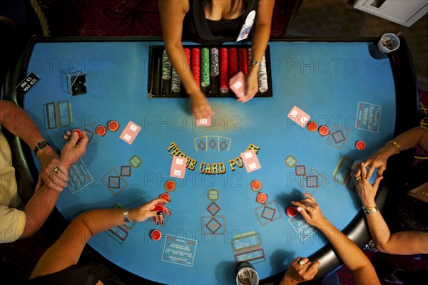 People playing poker in casino