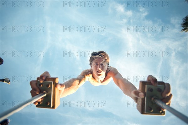 Caucasian man doing handstand