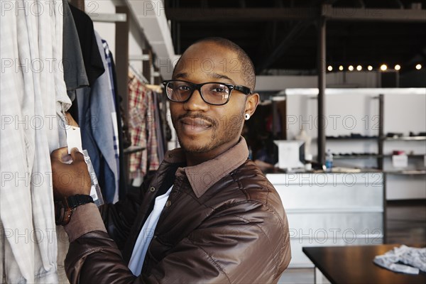 African American man shopping in clothing store