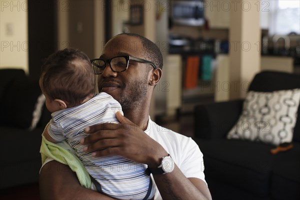 Father holding baby