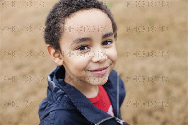 Mixed race boy smiling