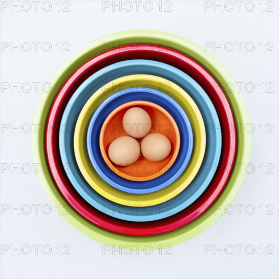 Eggs in colorful nesting bowls