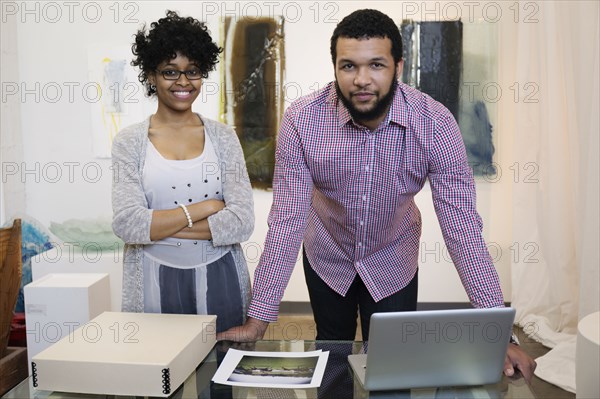 Business people working in art gallery