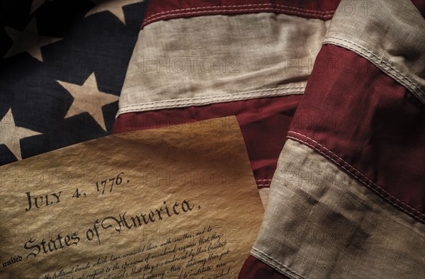 Close-up of Declaration of Independence resting on American flag