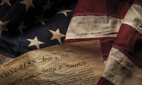 Close-up of Declaration of Independence resting on American flag