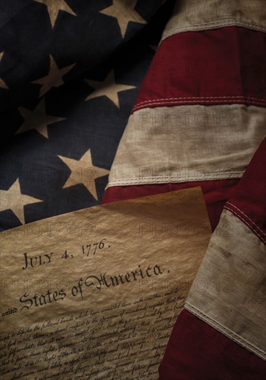 Close-up of Declaration of Independence resting on American flag