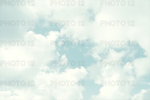 White cumulus clouds on blue sky