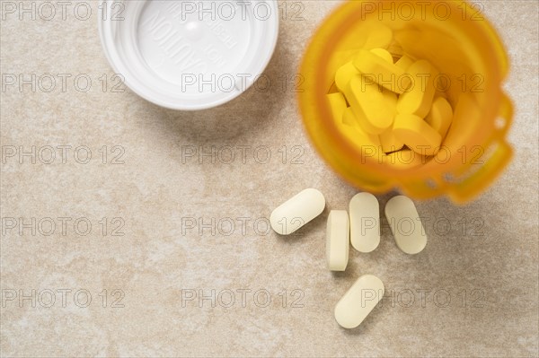 Overhead view of pills in prescription bottle