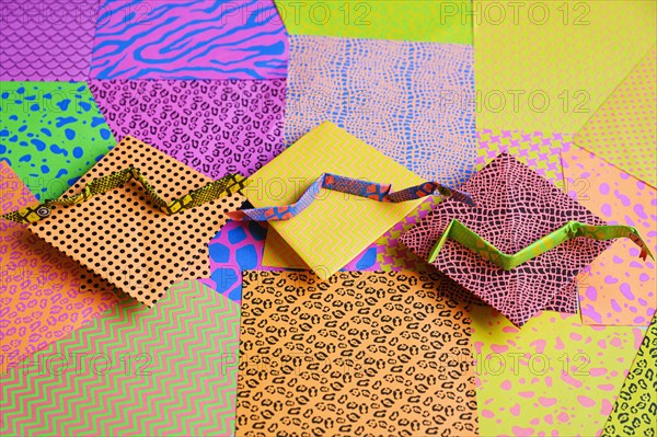Origami snakes on colorful origami papers