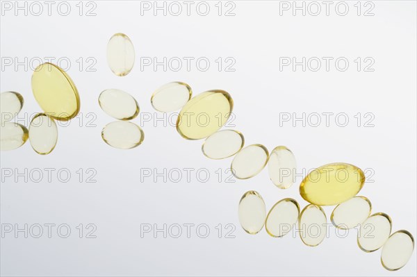 Fish oil pills on white background