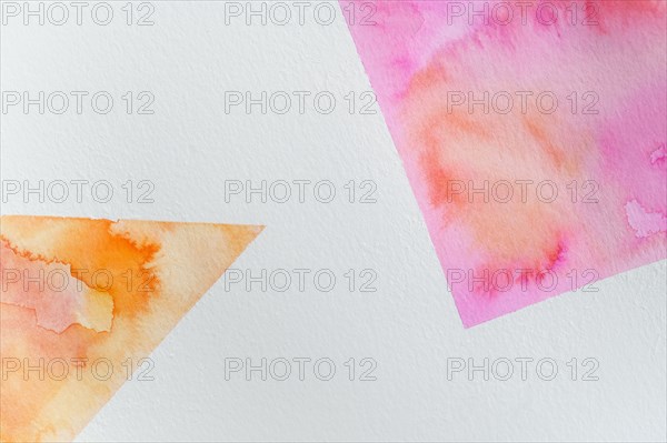 Close-up of watercolor colorful abstract shapes on white background