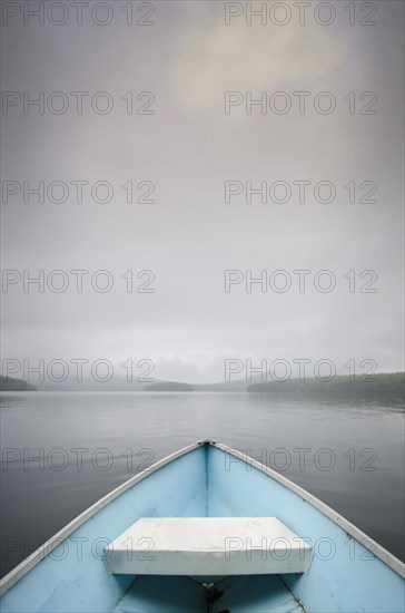 View from rowboat on foggy lake