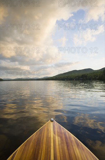 Wooden boat on Lake Placid at sunset