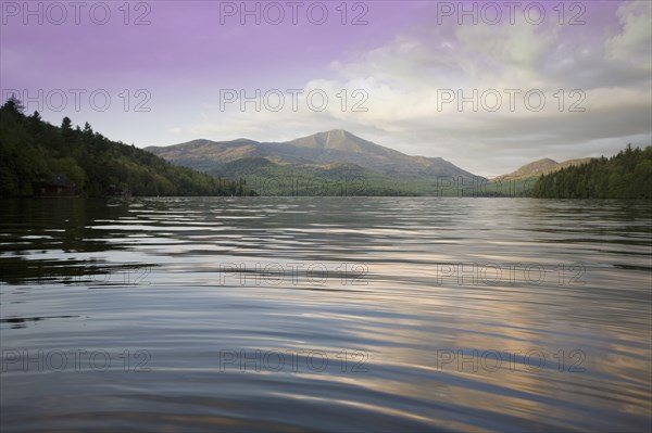 Calm Lake Placid and Whiteface Mountain at sunset